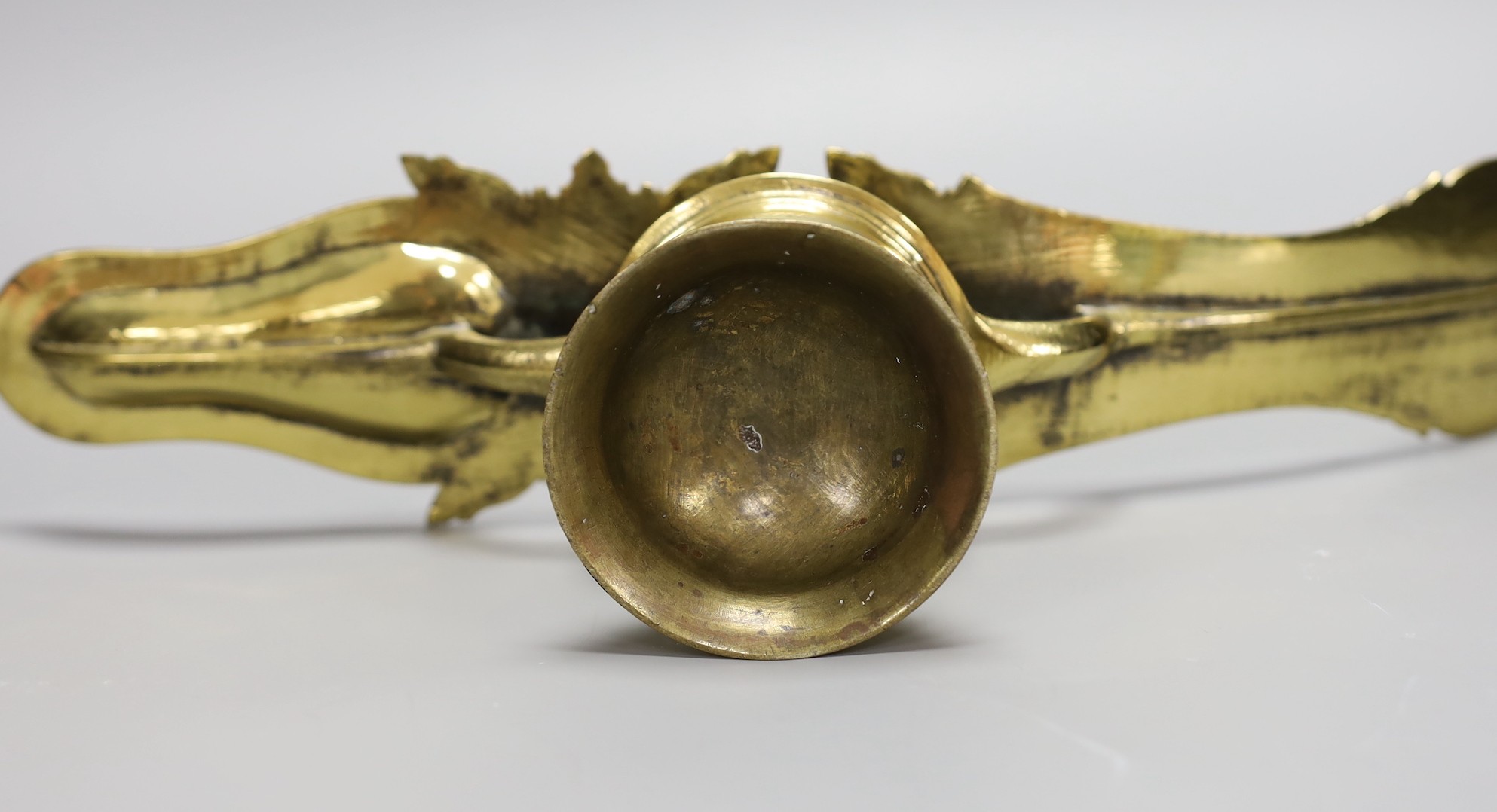 A 19th century Indian brass oil lamp, 45 cms wide